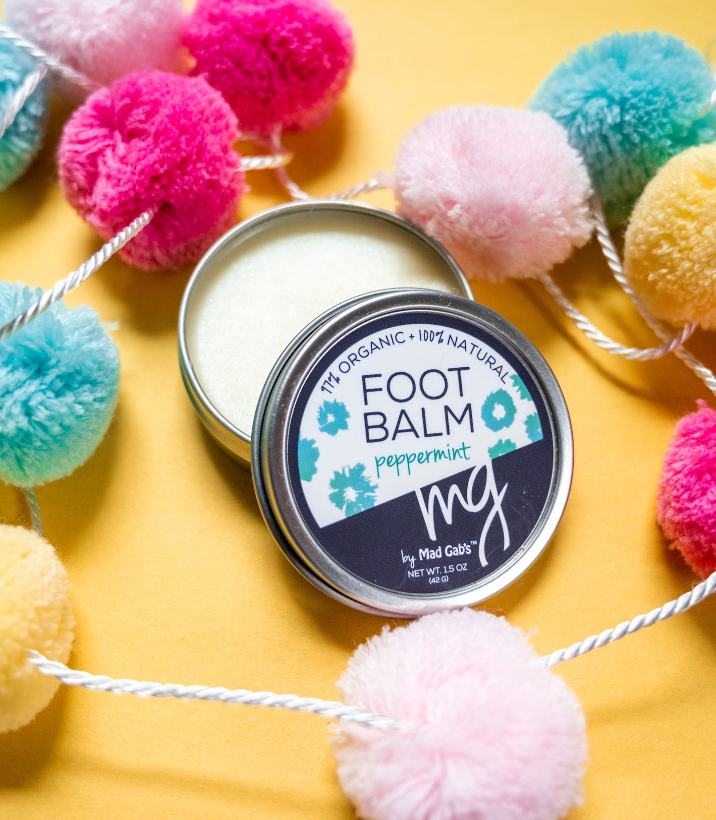 MG Signature by Mad Gab's Natural and Organic Peppermint Foot Balm Open Tin Colorful
