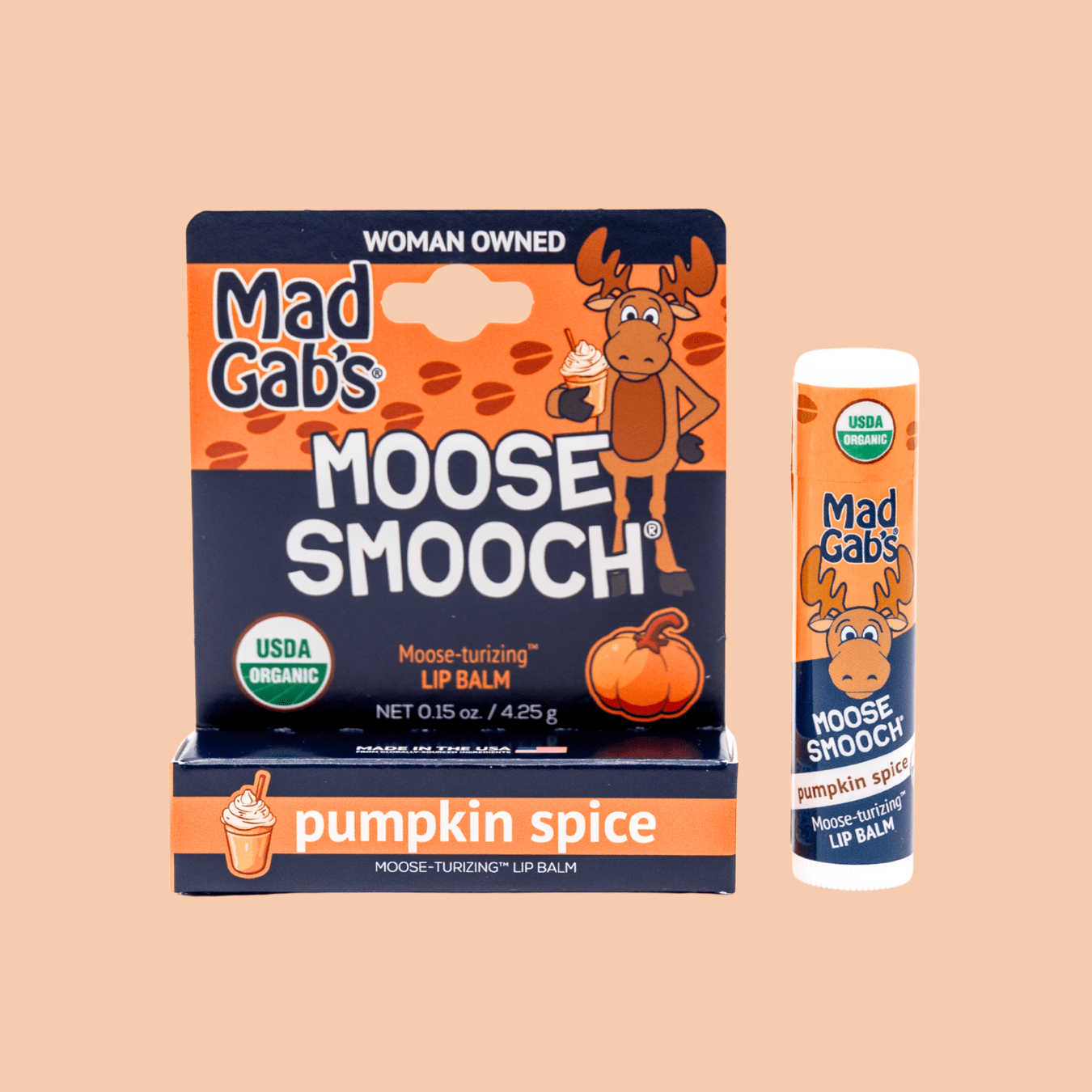 Mad Gab's Moose Smooch Lip Balm Pumpkin Spice flavor on a light orange background