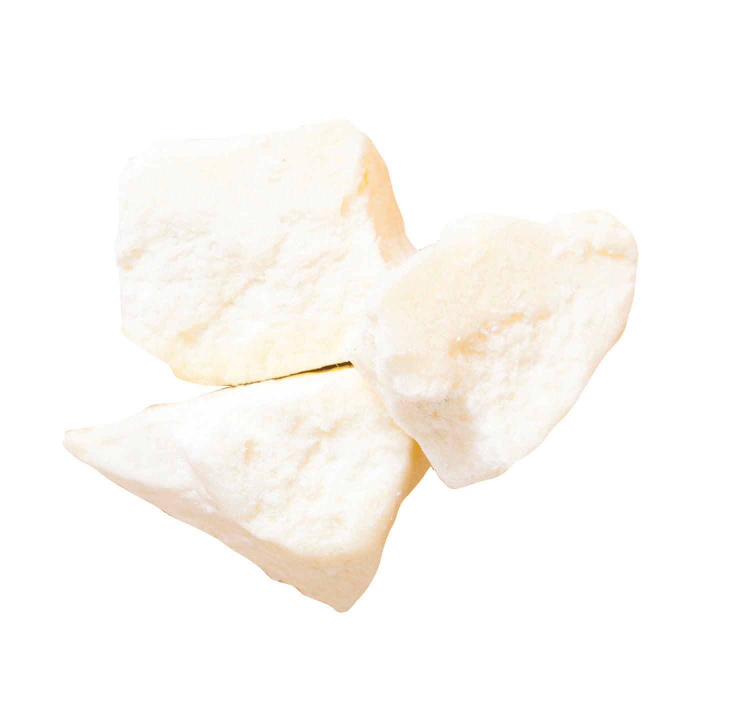 Three triangular pieces of shea butter on a white background