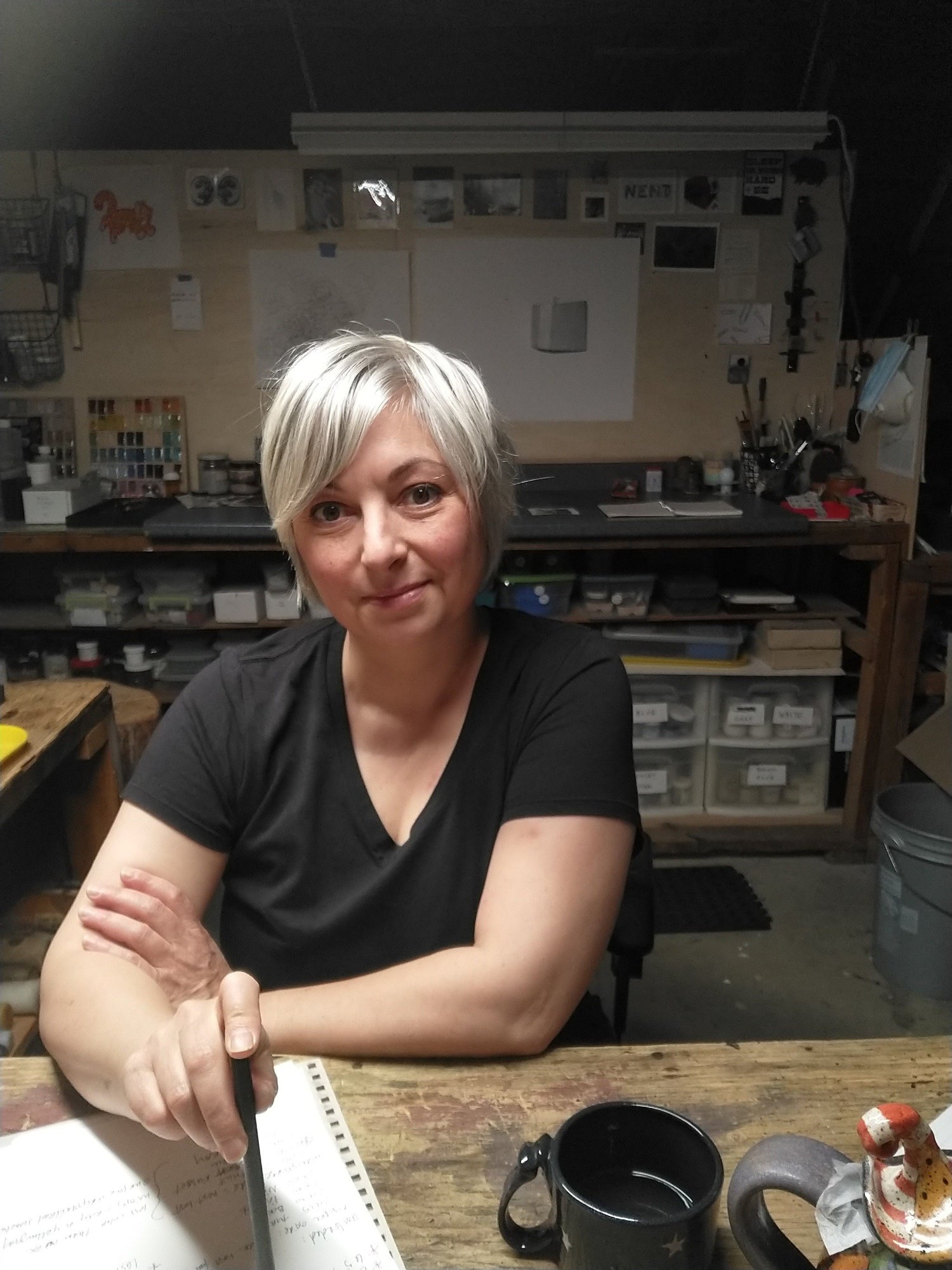 Woman sitting at a table in a workshop setting