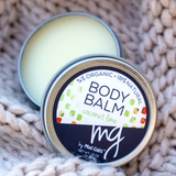 MG Signature by Mad Gab's Organic and Natural Coconut Lime Body Balm with a view inside the balm tin