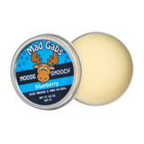 A capture of an open tin of Blueberry Moose Smooch .3 oz organic and natural lip care showing that the product is a natural cream color.